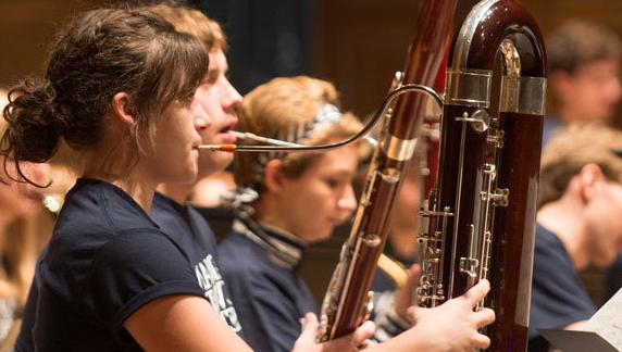 Student playing the bassoon in a orchestra